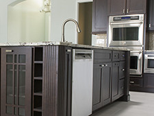 A large kitchen with a center island and brand new appliances