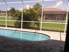 A fenced-in, outdoor, and in-ground pool.